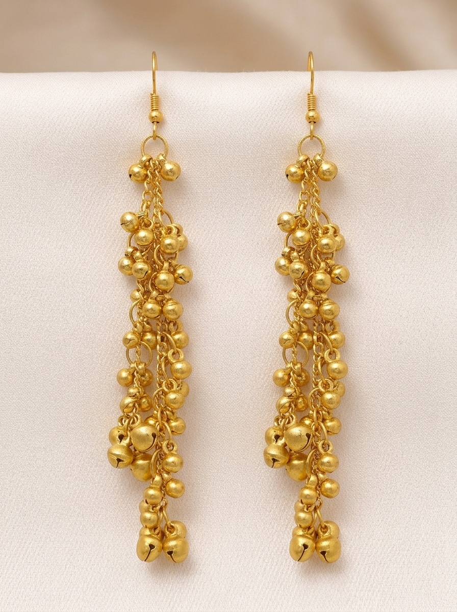 Front view of Zaira Golden Ghungroo Drops displaying fish-hook earrings with cascading gold chains and small ghungroo bells against a neutral background